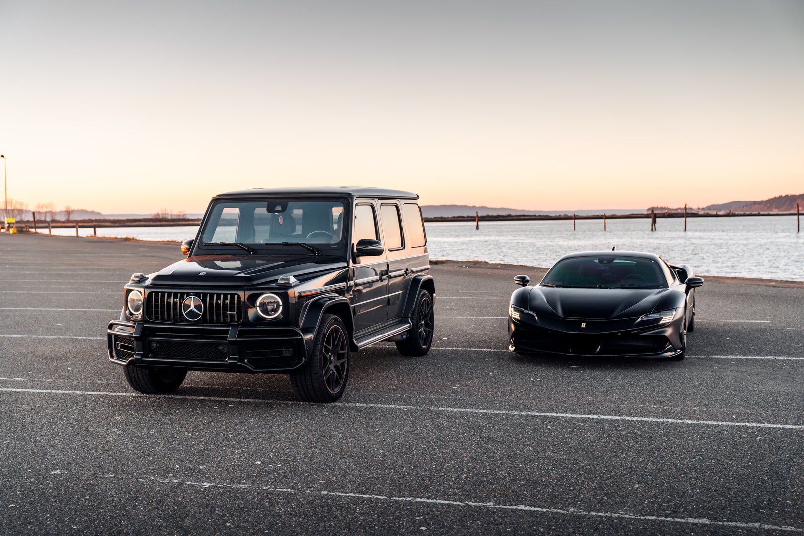 Seattle, WA, USA February 7, 2025 Ferrari SF90 Stradale and G Wagon parked in front of a lake