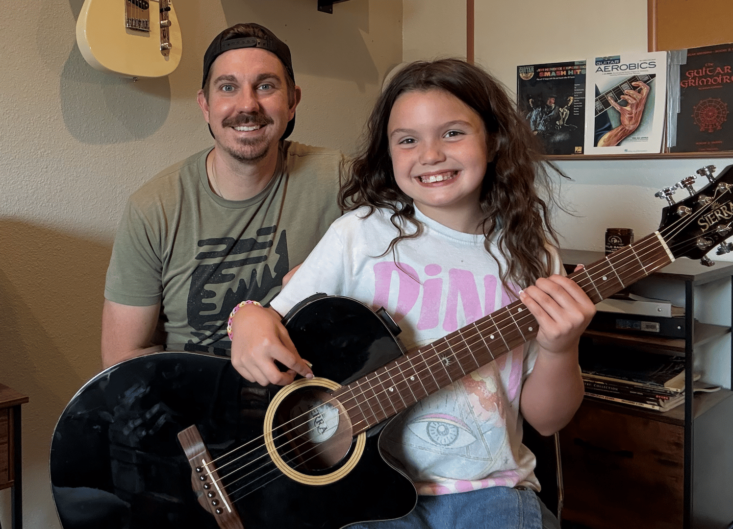 Teaching guitar student