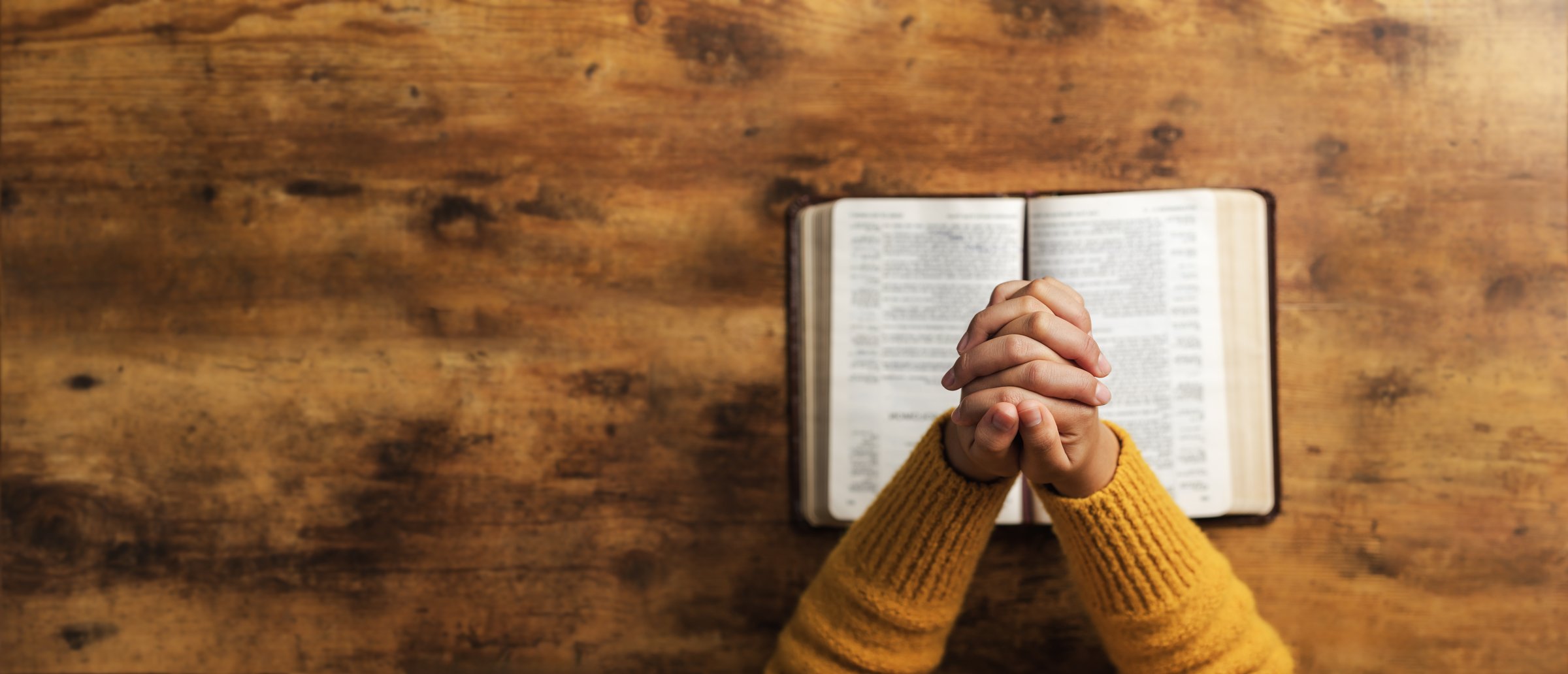 Pray to God with the holy scriptures. Prayer concept asking for a higher power for praise or hope and Christian Faith Spirituality and Religion. copy space background