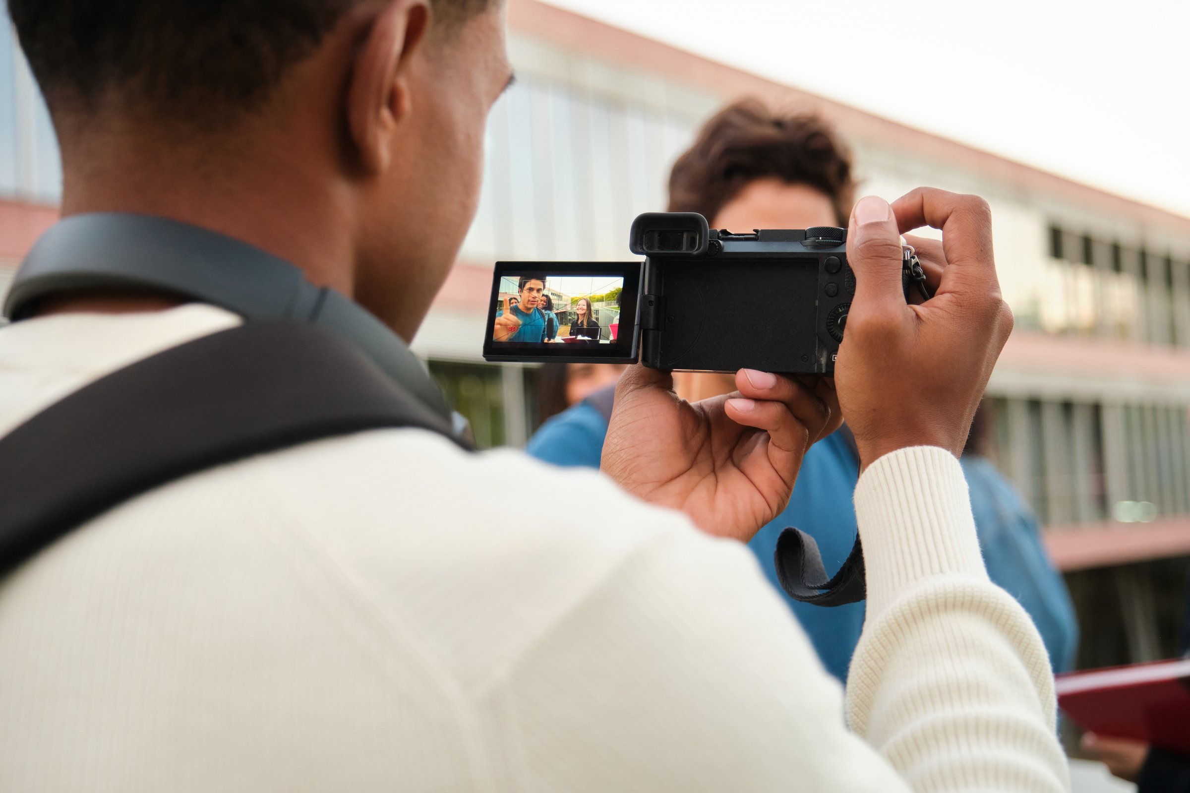 Young man recording with camera