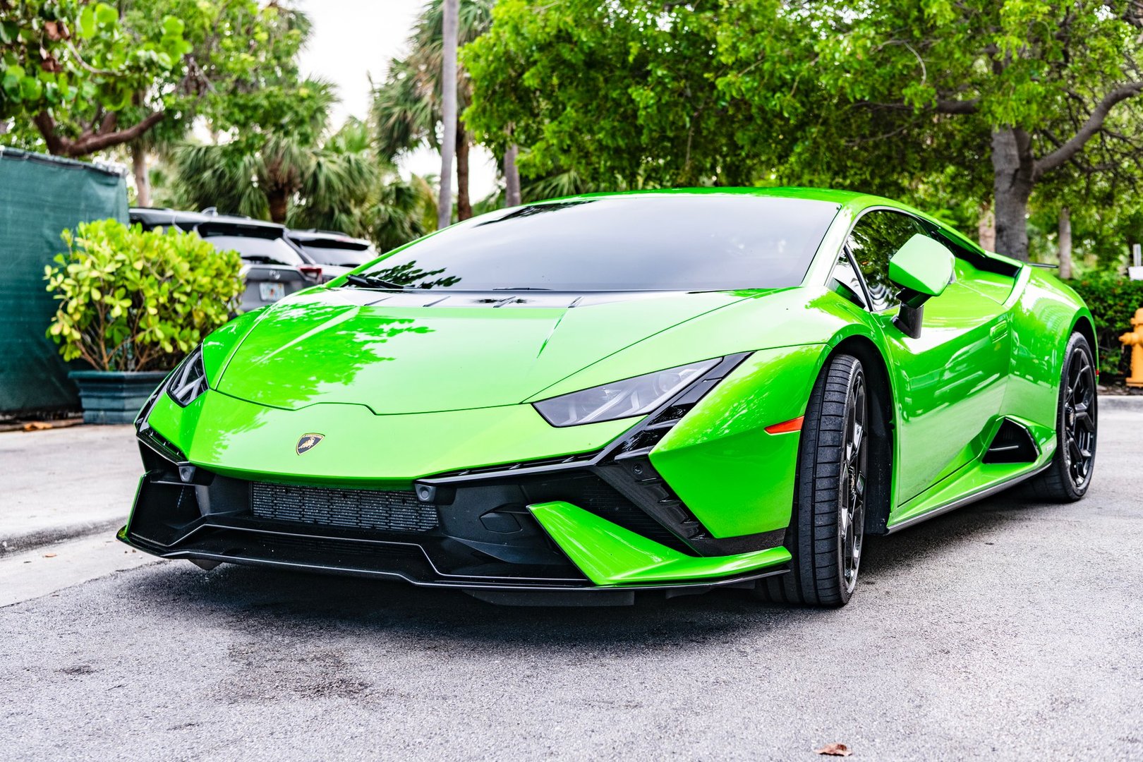 Miami Beach, Florida USA - June 9, 2024: 2023 Lamborghini Huracan Tecnica green at miami beach. Lamborghini is a luxury italian car maker