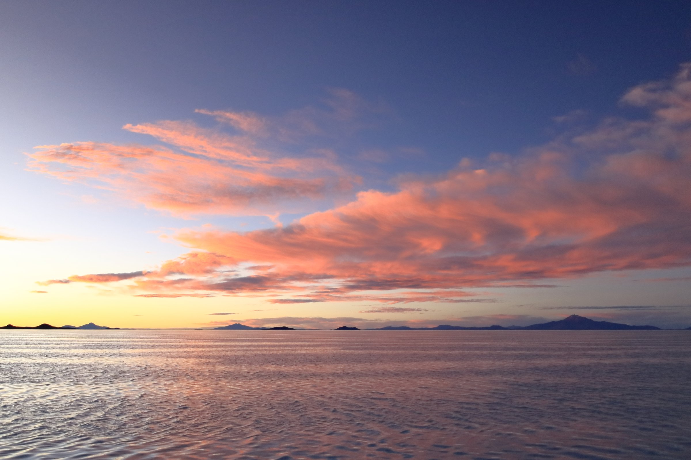 Sunset over the Salar de Uyuni, the world's largest salt flat in Bolivia