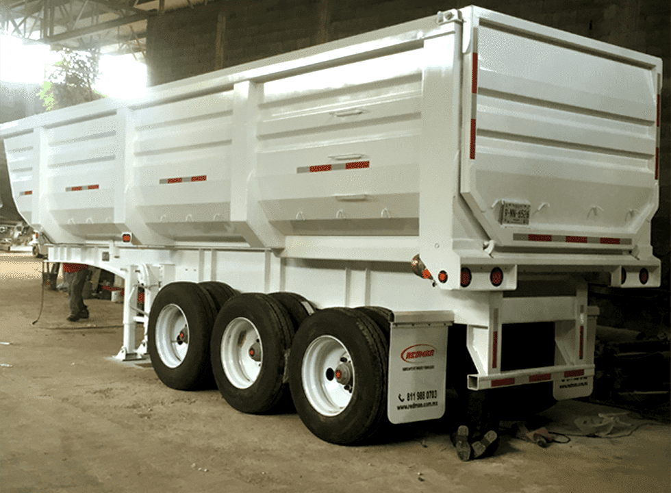 End dump trailer gondola for heavy bulk materials transport