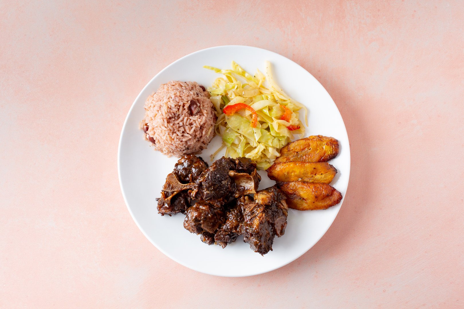 A top down view of an entree of Jamaican oxtails.