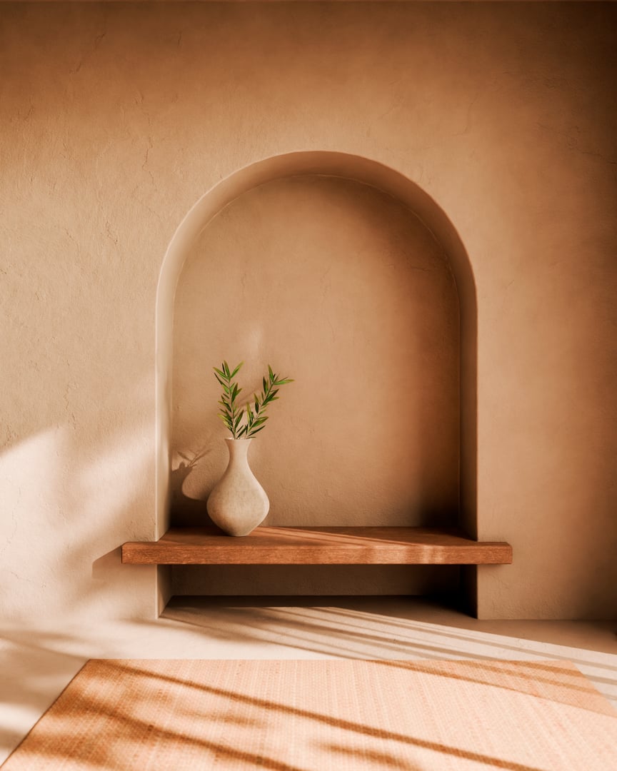 Aesthetic home decor with olive branch in vase on wood table and plaster wall, window sunlight shadow. Interior decoration in neutral boho style using natural material. Home design background.