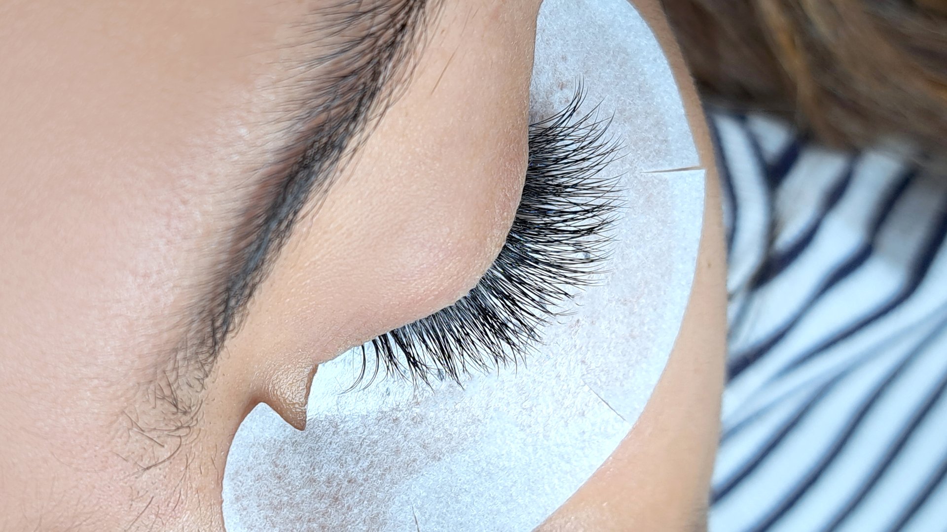 Close up of eye with eyelash extensions ,beauty salon treatment ,2d volume, 3d volume, classical lashes,Russian volume,megavolume