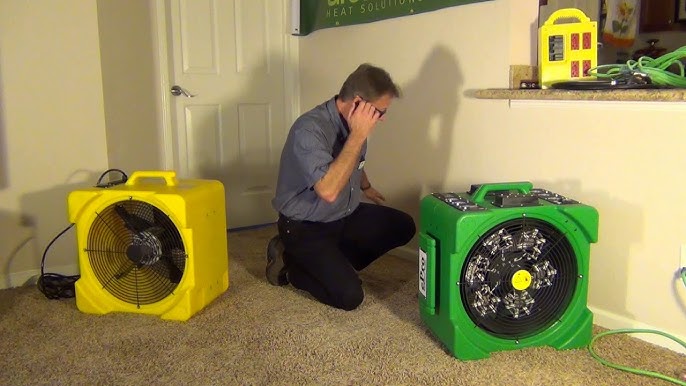 Professional bed bug heat treatment equipment in action with multiple fans and heating units deployed in residential setting