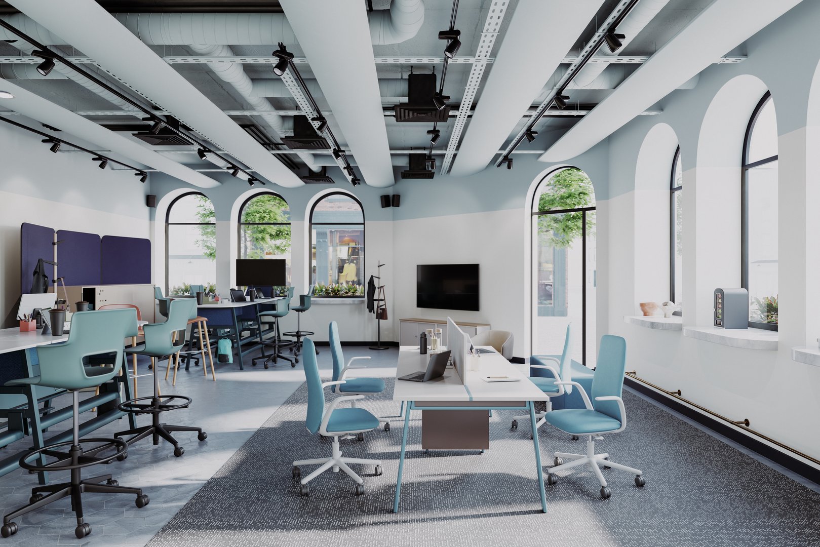 Creative open plan co-working office space in pastel tones.
