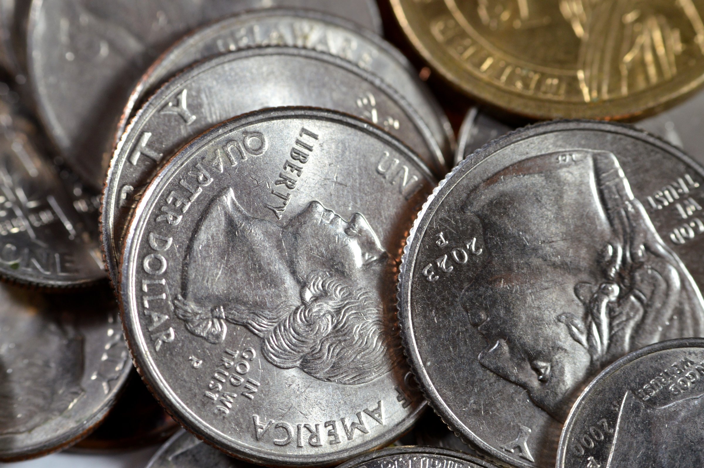 Pile of American coins of 1 cent, 5, 10, 25 cents quarter and one dollar, Vintage retro old American money background, United States of America dollars change coins, United States of America change