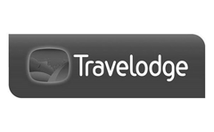 Travelodge logo featuring stylized bed and moon in a dark rectangular design.