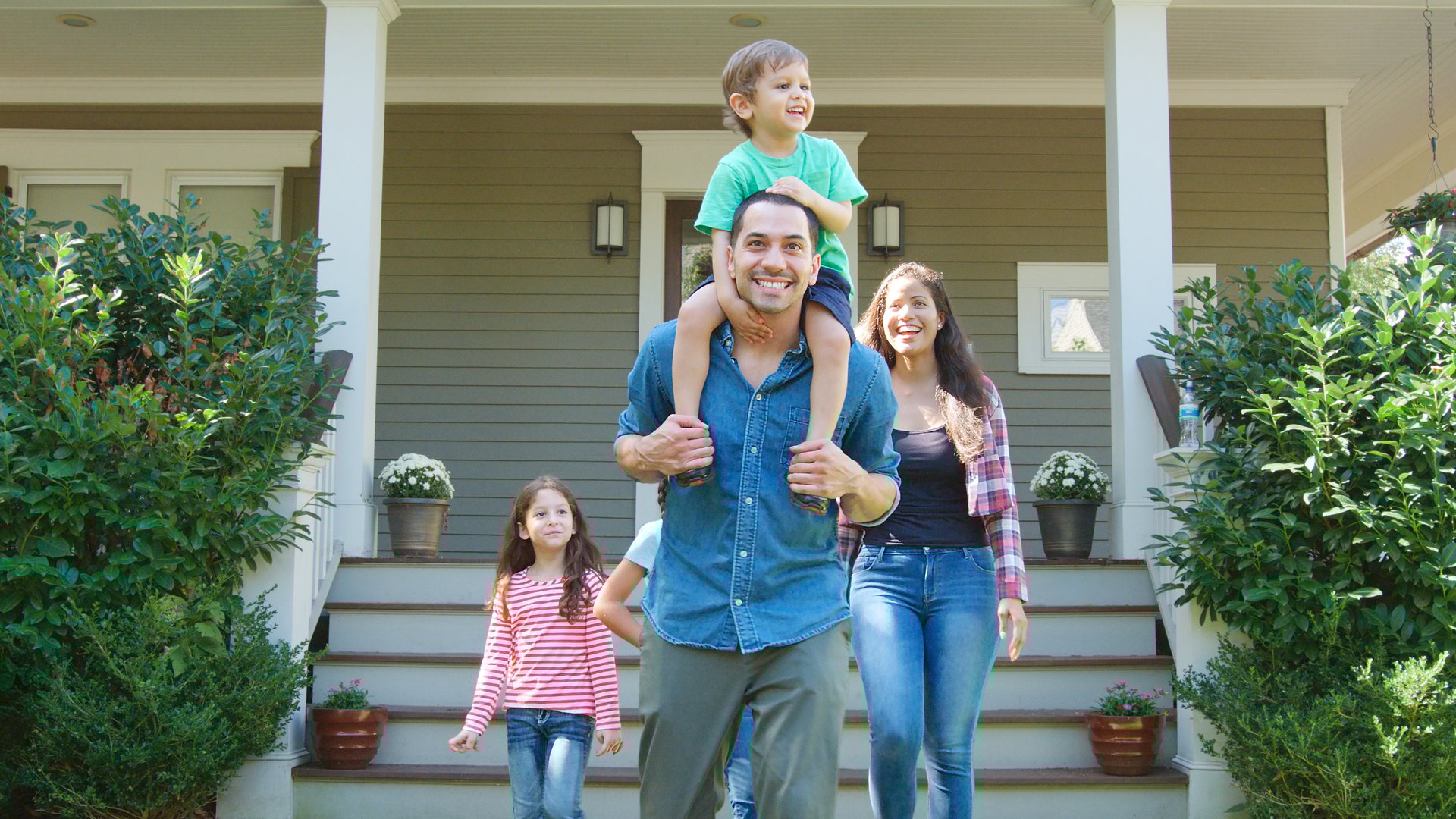 Father Gives Son Ride On Shoulders As Family Leave House