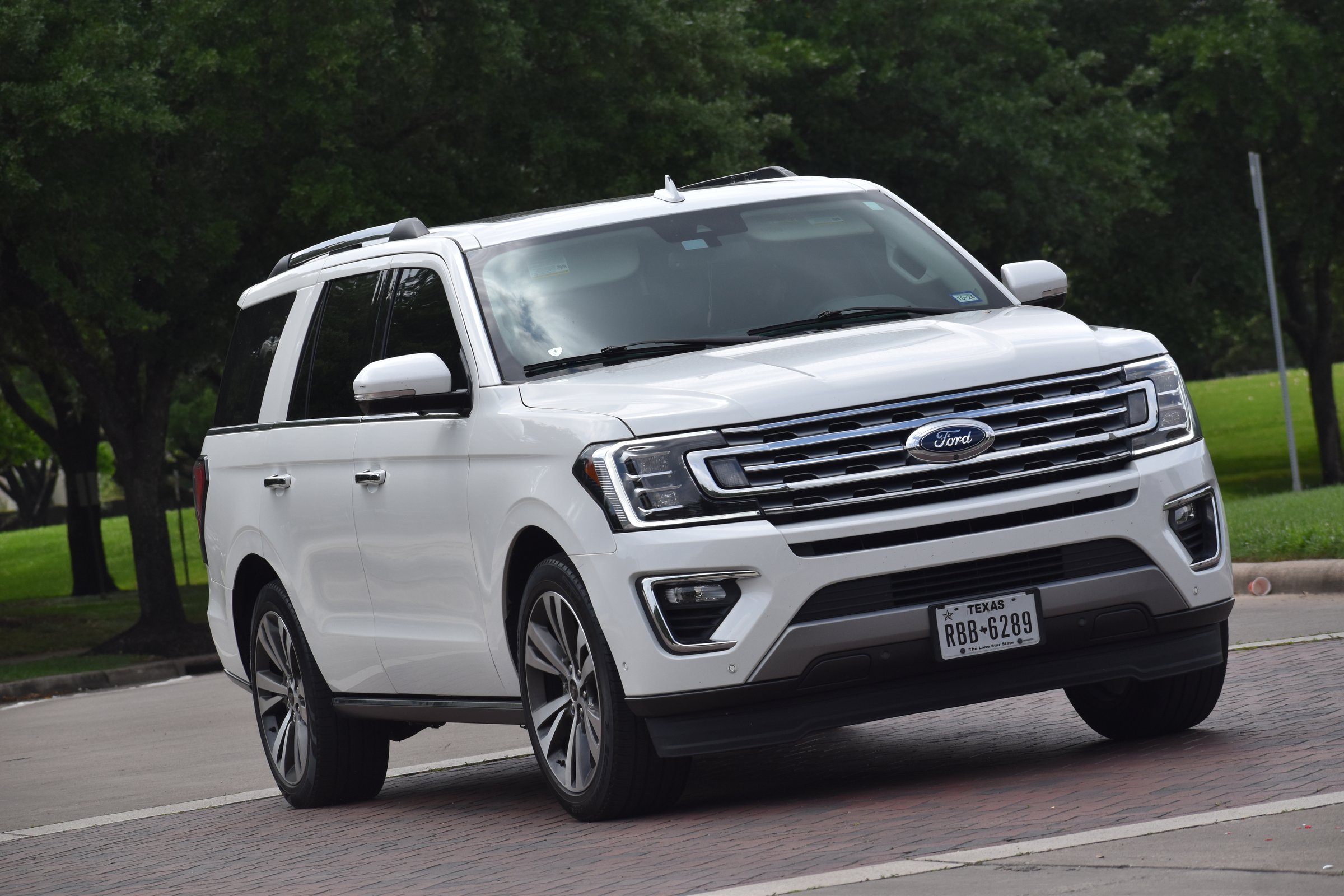 Houston, TX USA 5-29-2023 - A white Ford Expedition SUV cruising near Herman Park in Houston