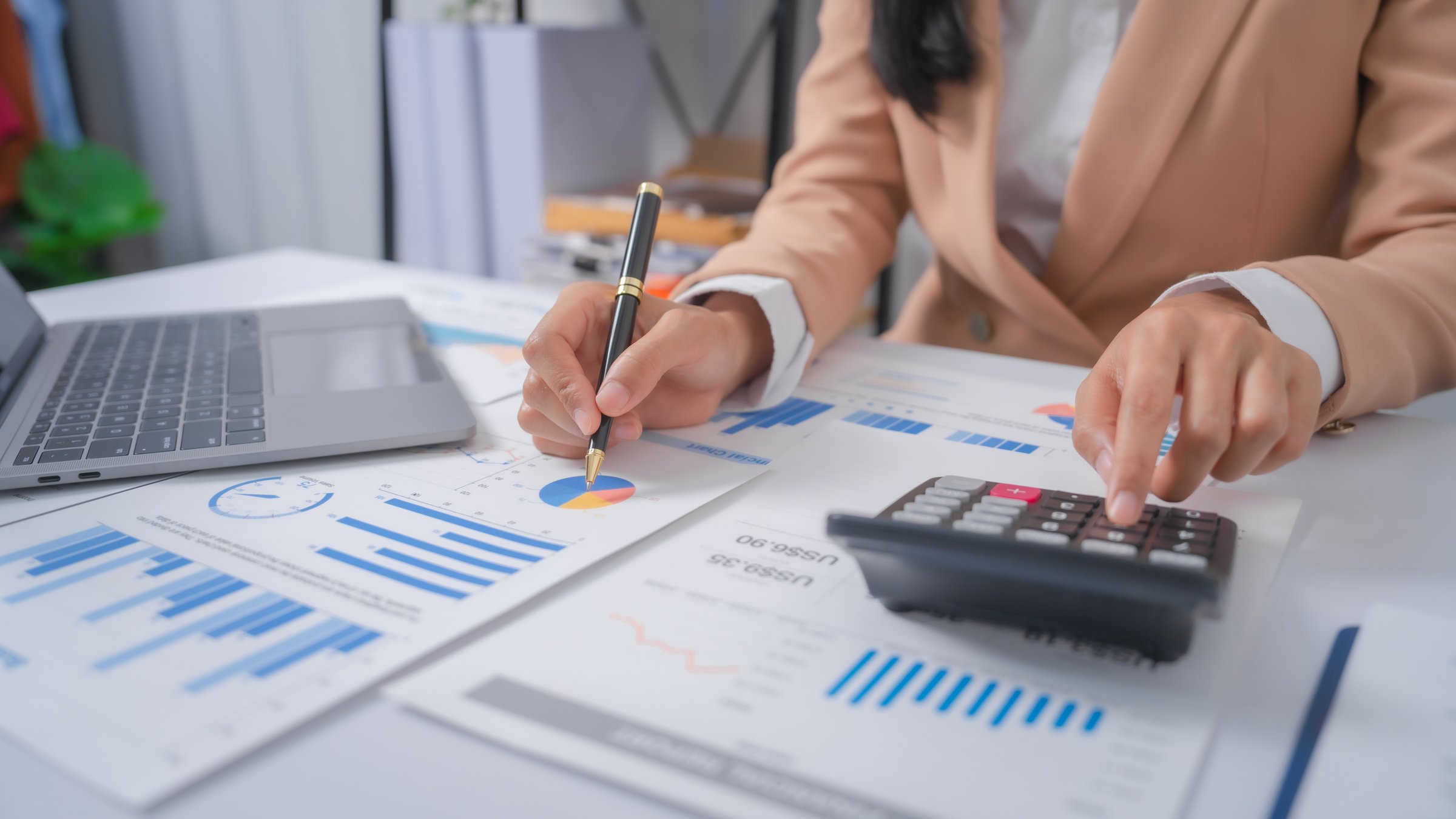 Excited Asian bookkeepers doing bookkeeping, accounts payable, assets, book value, equity, inventory, liabilities, cost of goods sold, depreciation, expenses, Gross profit, diversification, liquidity