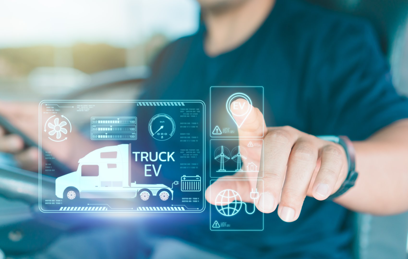 Man truck driver uses virtual screen touches to search for location Electric truck charging station for solar panels and wind turbines.Transportation and driving technology Using clean energy