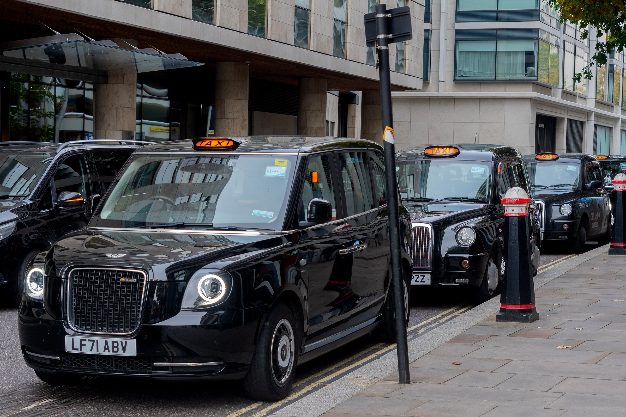 London UK black cabs queued up waiting for passengers