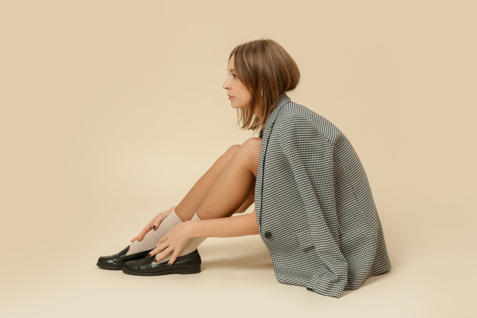 Serie of studio photos of women in classic pepito blazer, socks and black leather moccasins