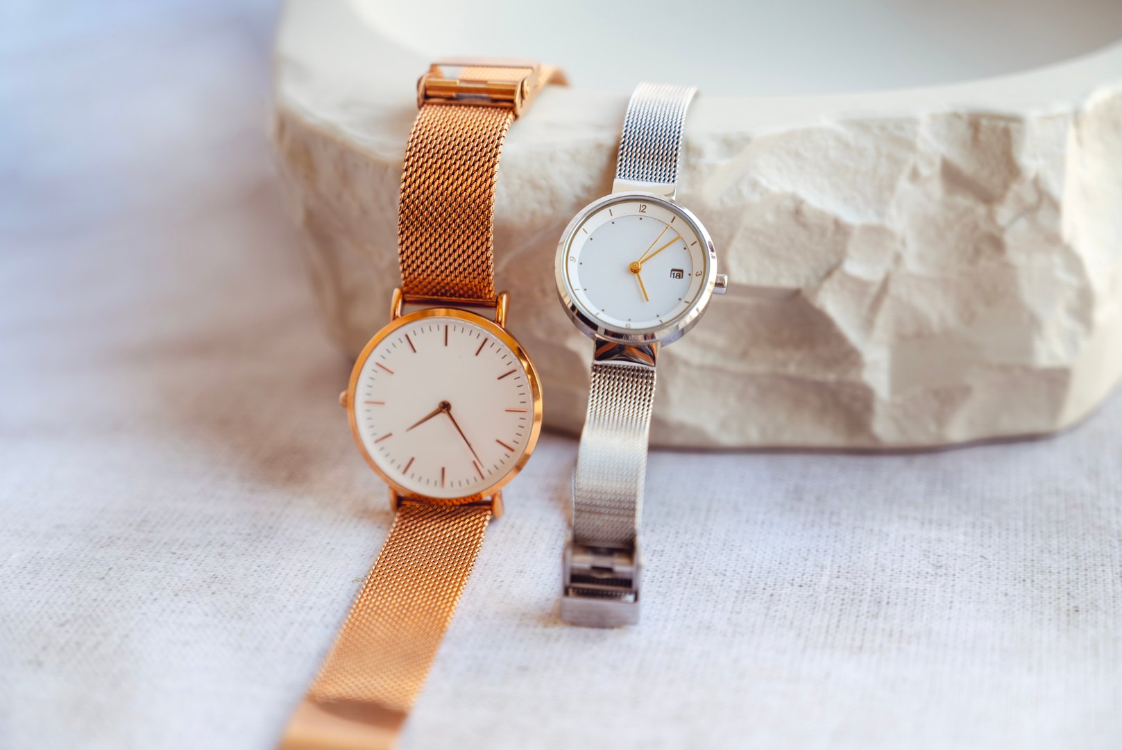 Modern Silver and Golden watches in stone tray