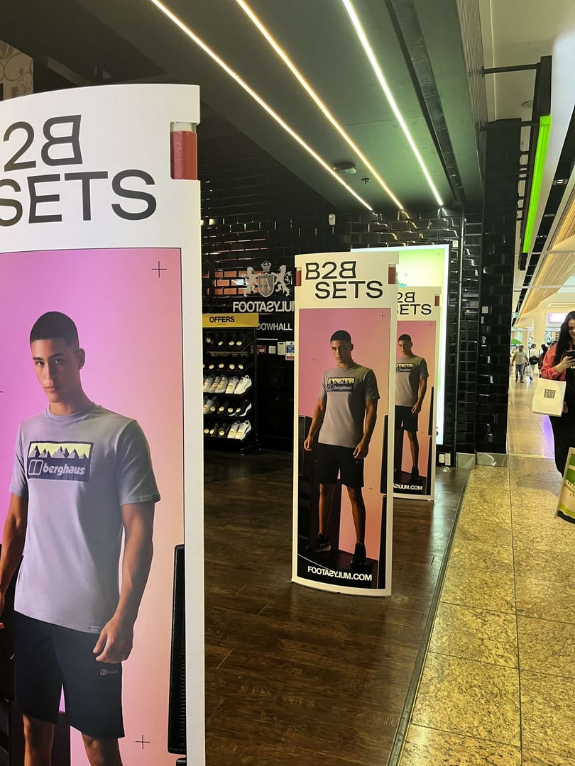 Professional fashion model featured in H&M B2B in-store retail marketing campaign