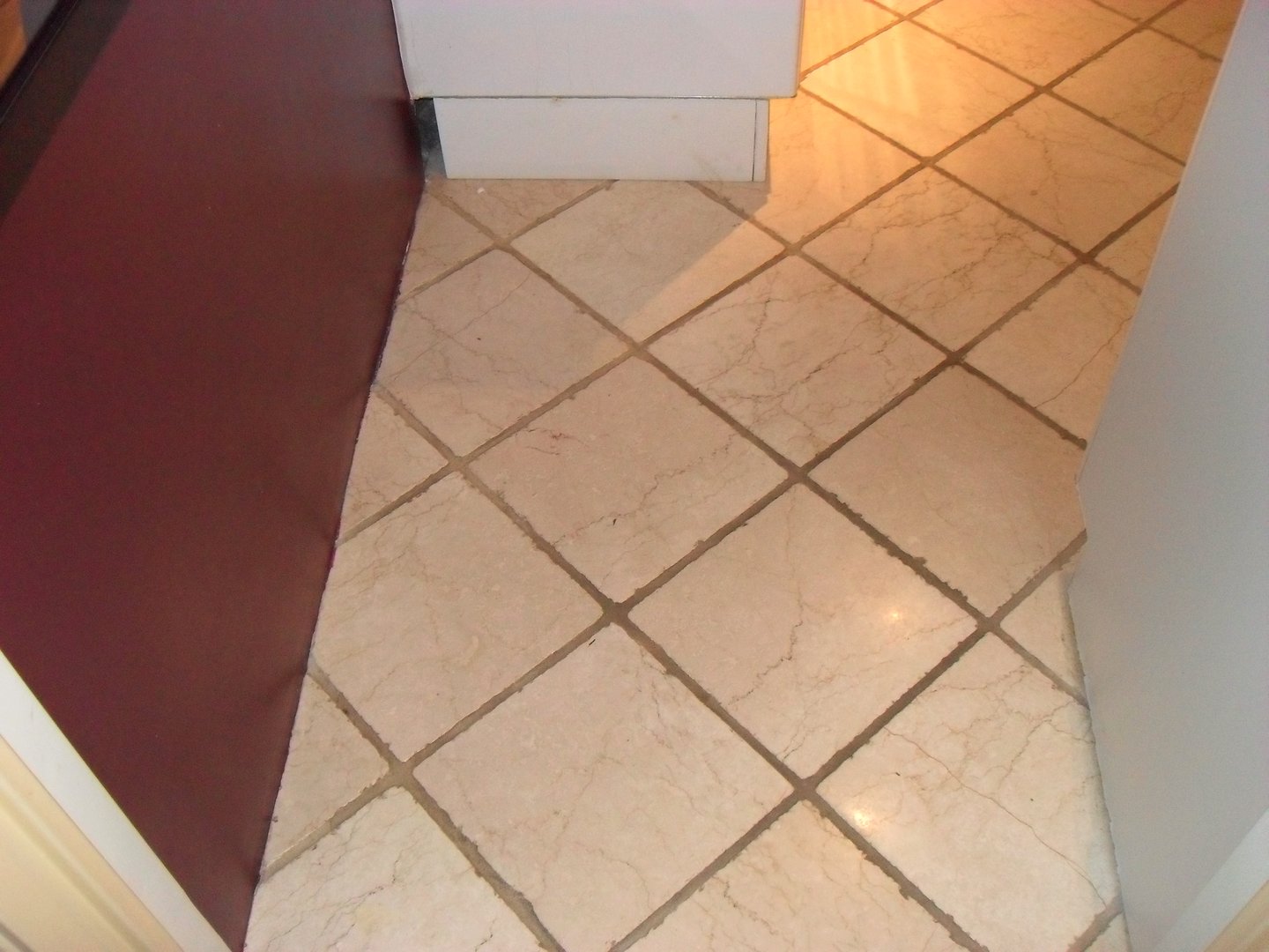 Tile floor before grout restoration