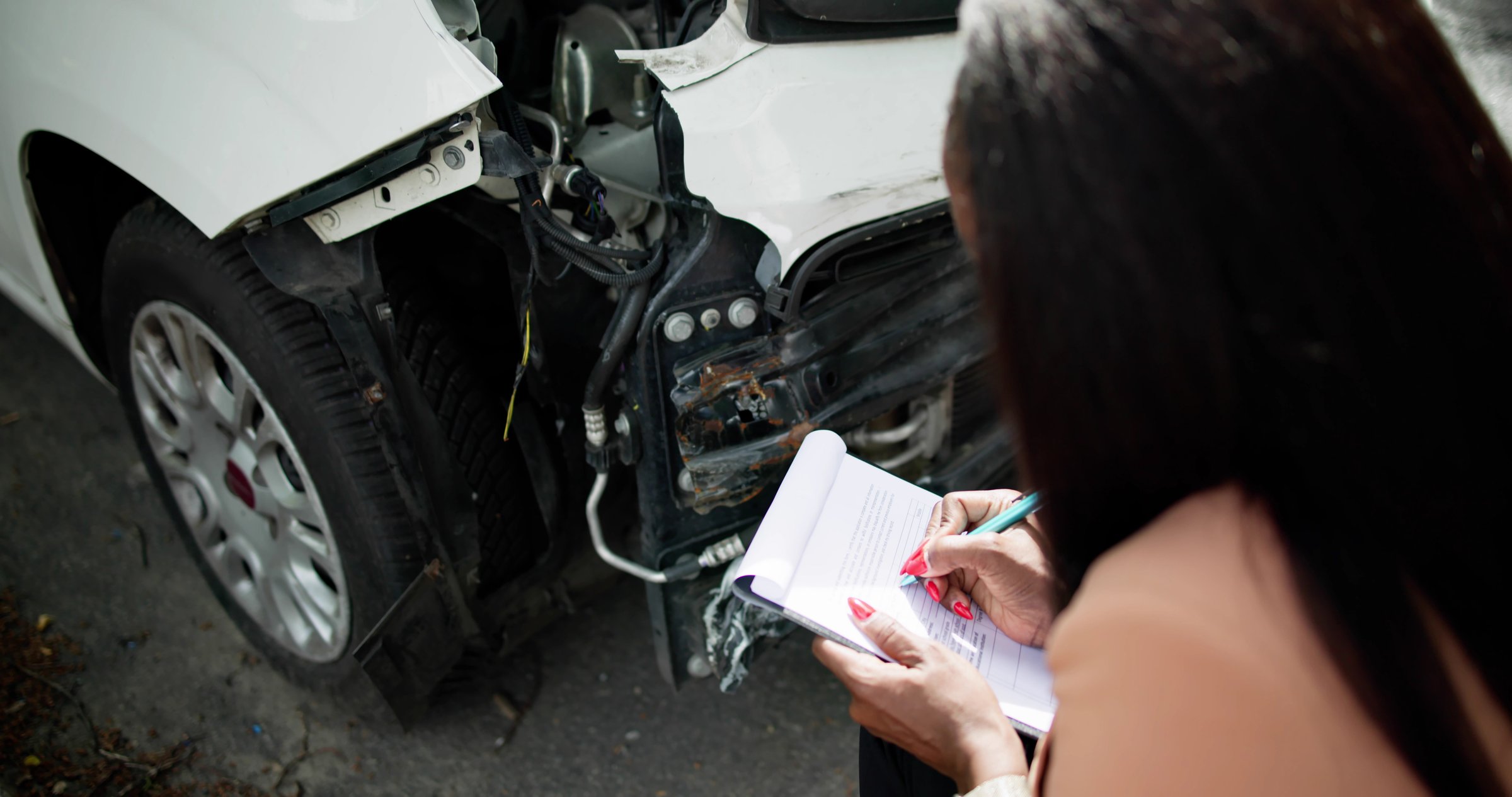 African American Car Insurance Agent Inspecting Accident Claim