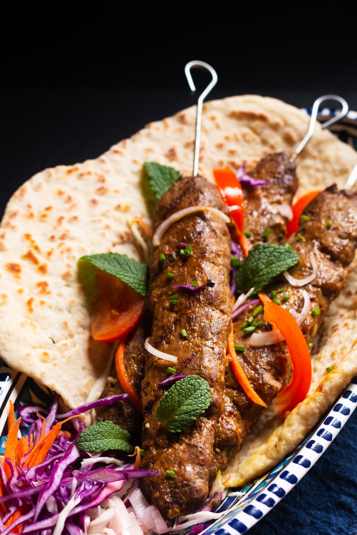 Food concept homemade Shish kofta Kebab on black slate stone background with copy space