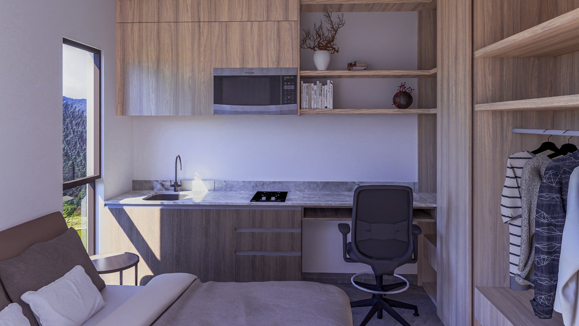 Modern studio apartment with bed, desk, chair, kitchenette, and open closet with mountain view from window.