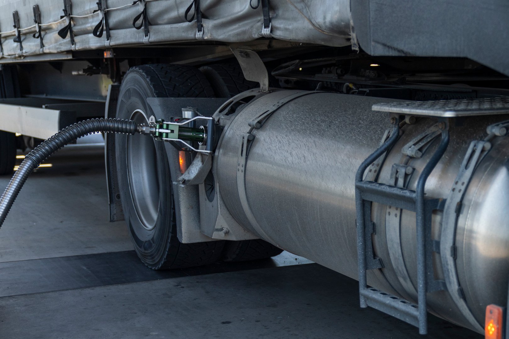 Semi truck refueling with tank for liquid natural gas (LNG).