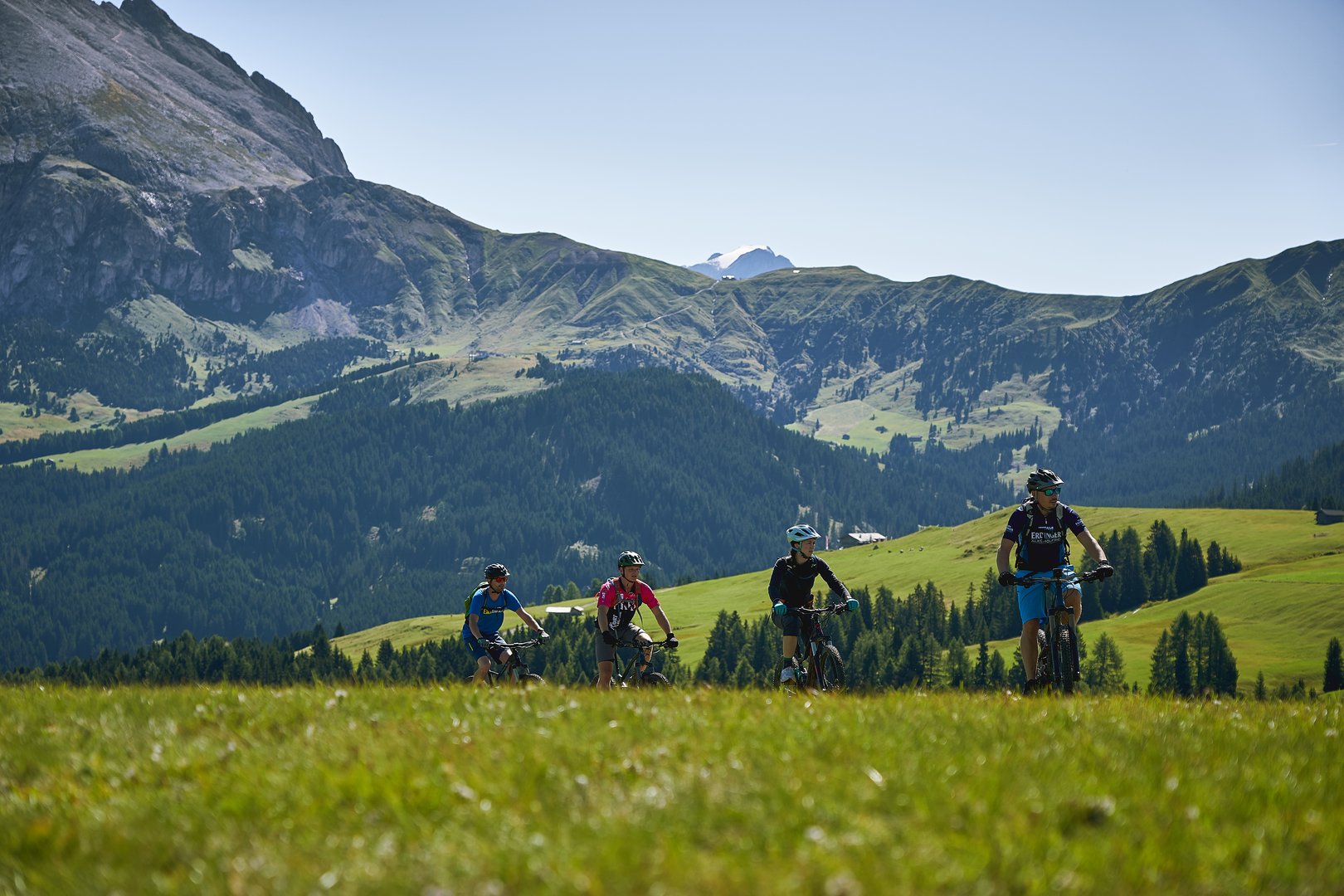 Seiser Alm, Italy - September, 2019. Tourists mountain biking on the Seiser Alm (Alpe di Siusi in Italian) during Summer