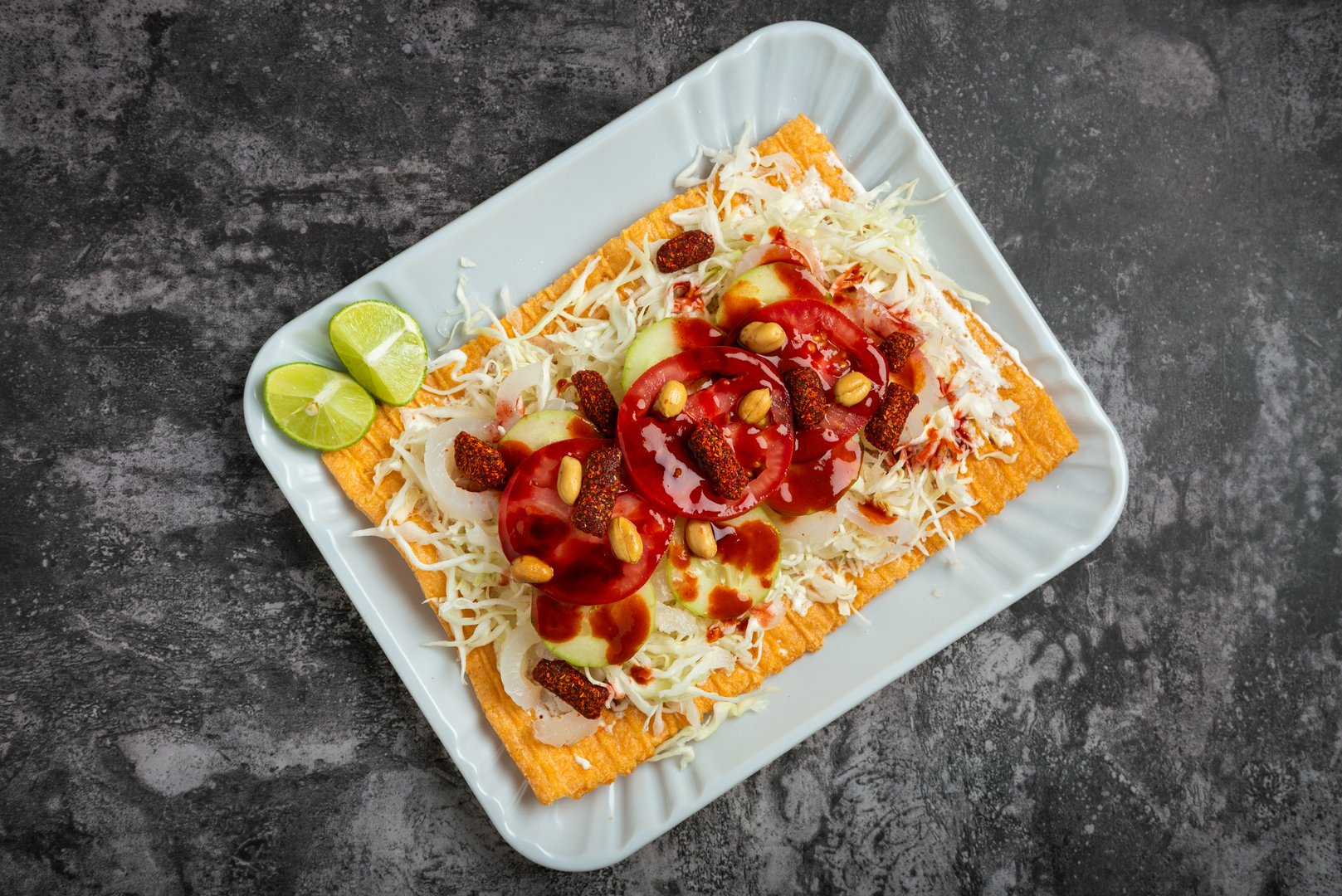Flour chicharron prepared with sauce, vegetables and pickled pork skin. Mexican fast food.