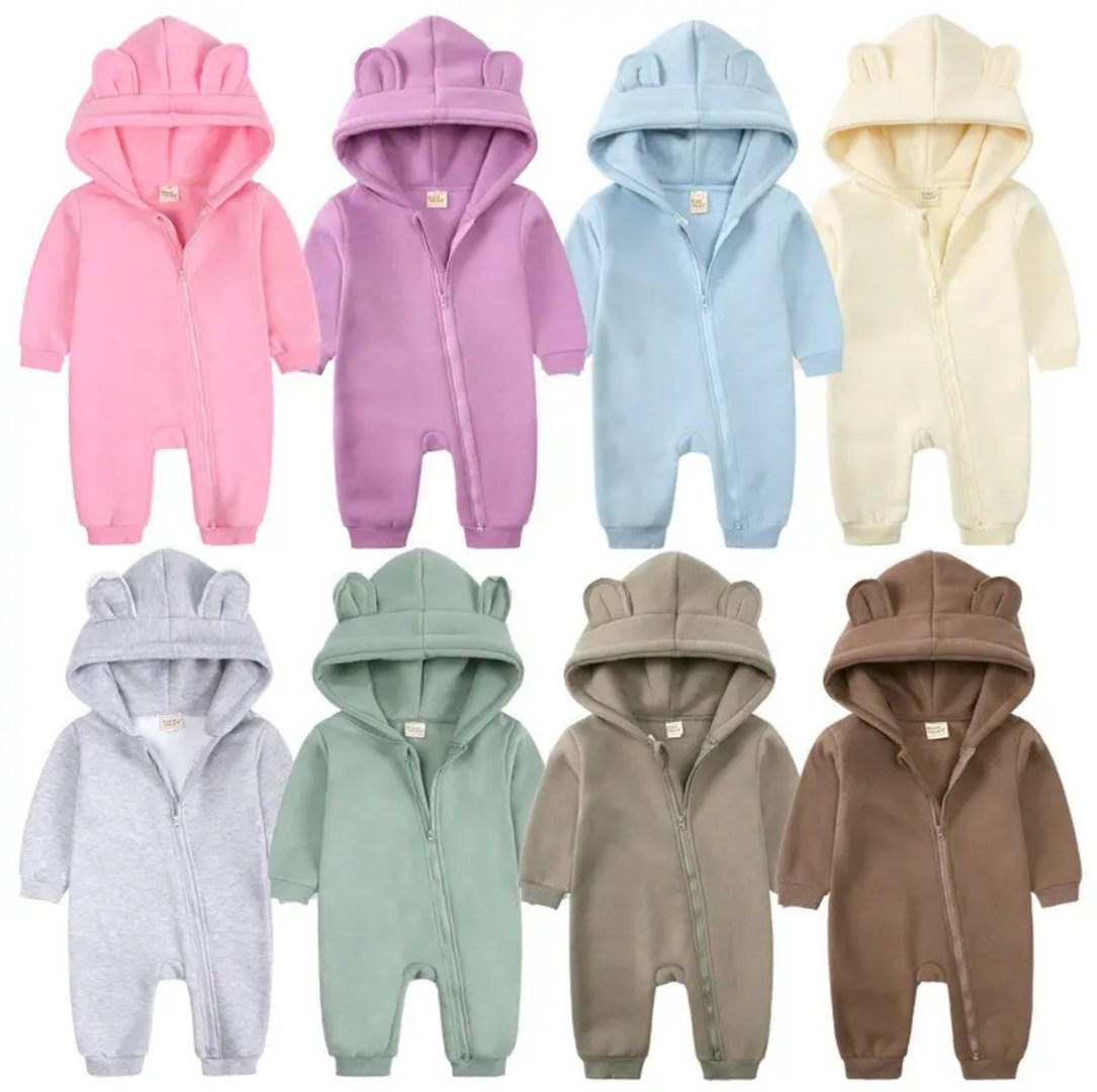 Baby onesies with bear ears in various pastel colors: pink, purple, blue, cream, gray, green, brown. 10 pieces displayed.