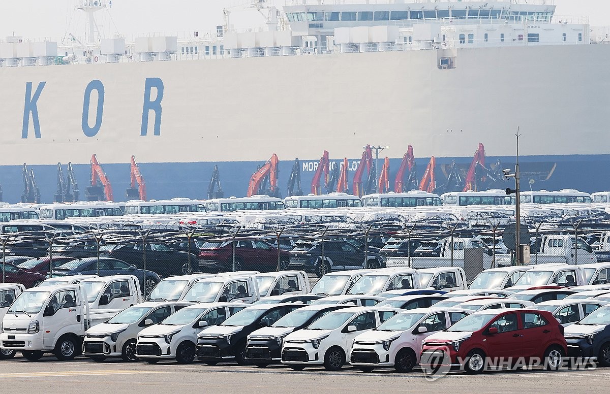 Car transporter ship loaded with vehicles for international shipping