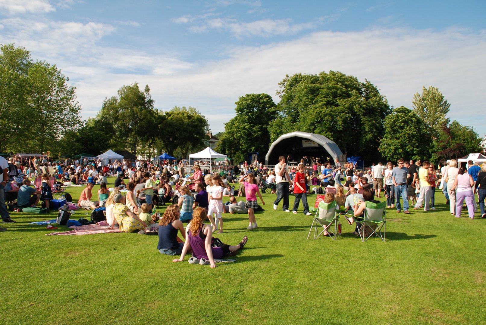 "Tenterden, England - June 13, 2009: The audience watching the free local music festival at Tenterden in Kent. The annual event held in the local public park showcases local talent."
