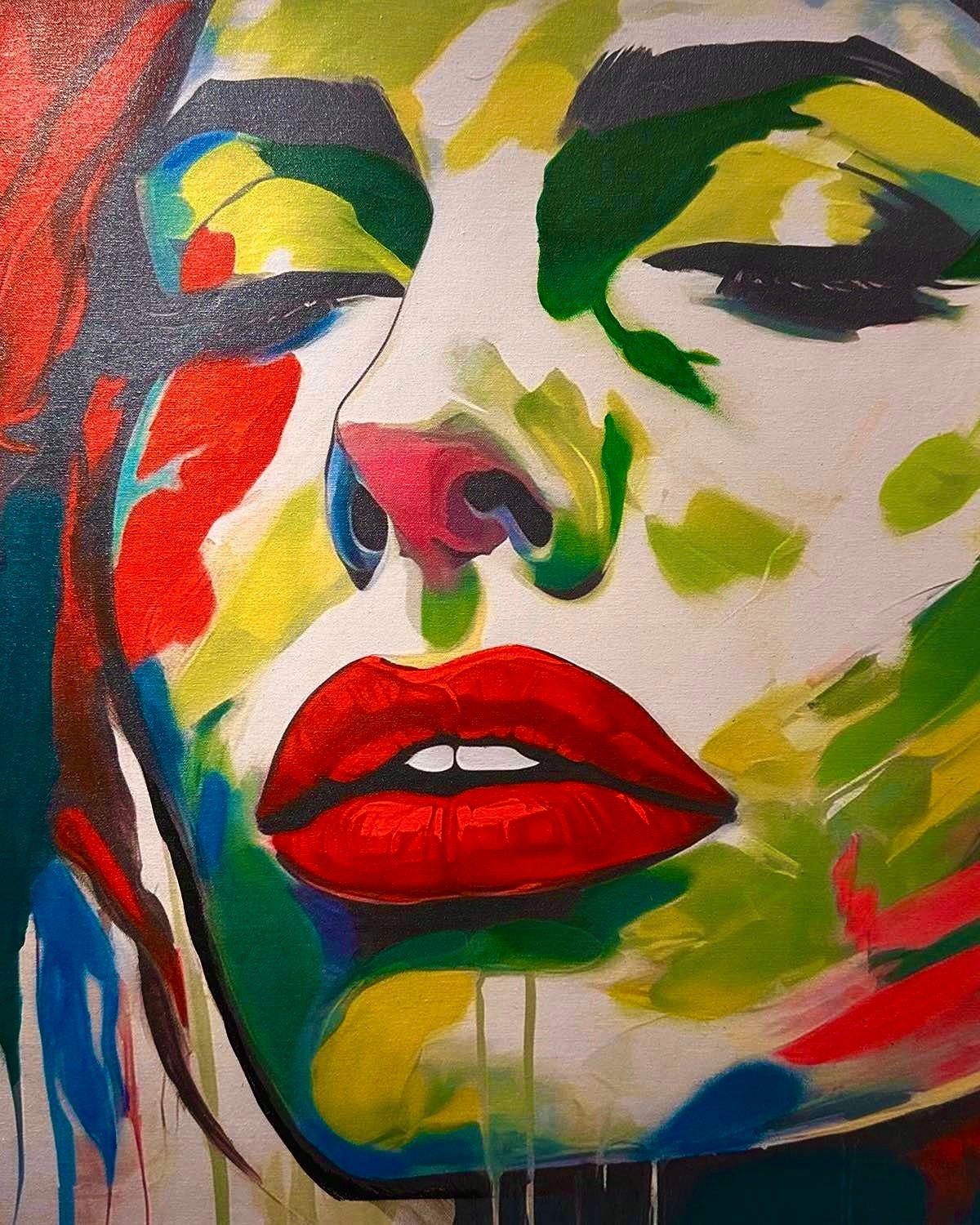 Vibrant abstract portrait depicting a womans face with colorful brushstrokes, closed eyes, and bold red lips.
