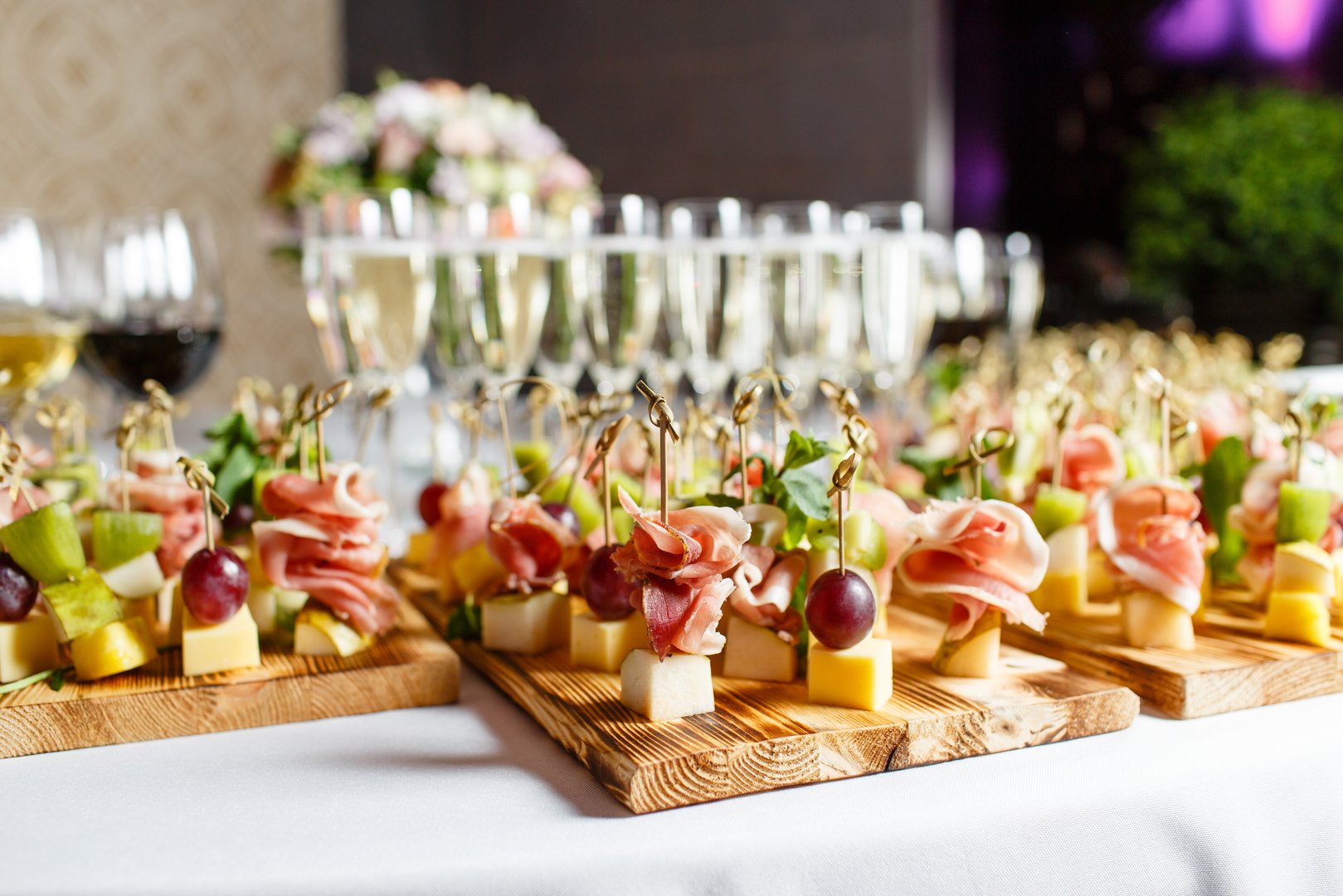 the buffet at the reception. Assortment of canapes. Banquet service. catering food, snacks with cheese, jamon, prosciutto and fruit