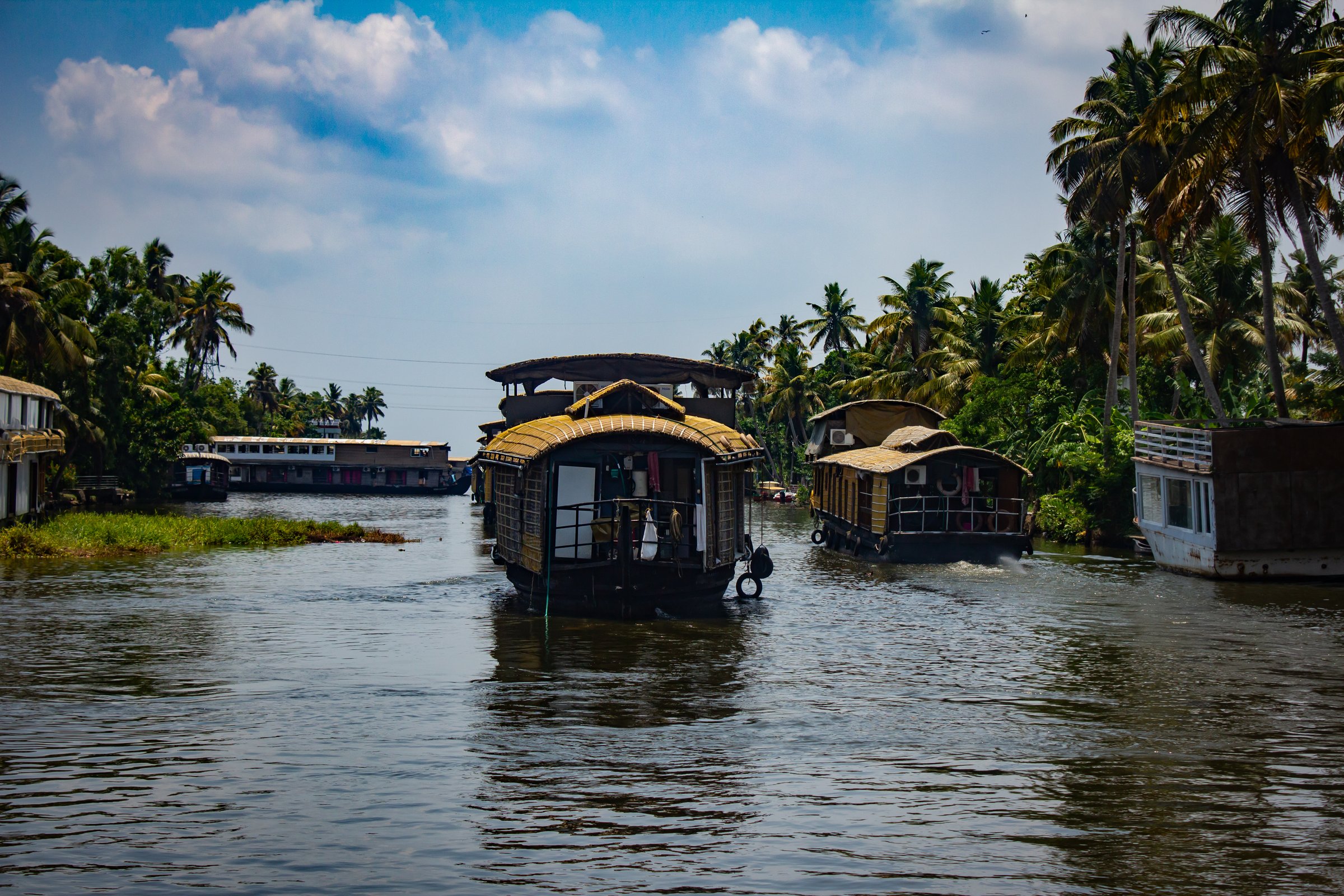 Houseboats cruising along the Alappuzha backwaters in the indian state of Kerala. Referred to as the Venice of the East.