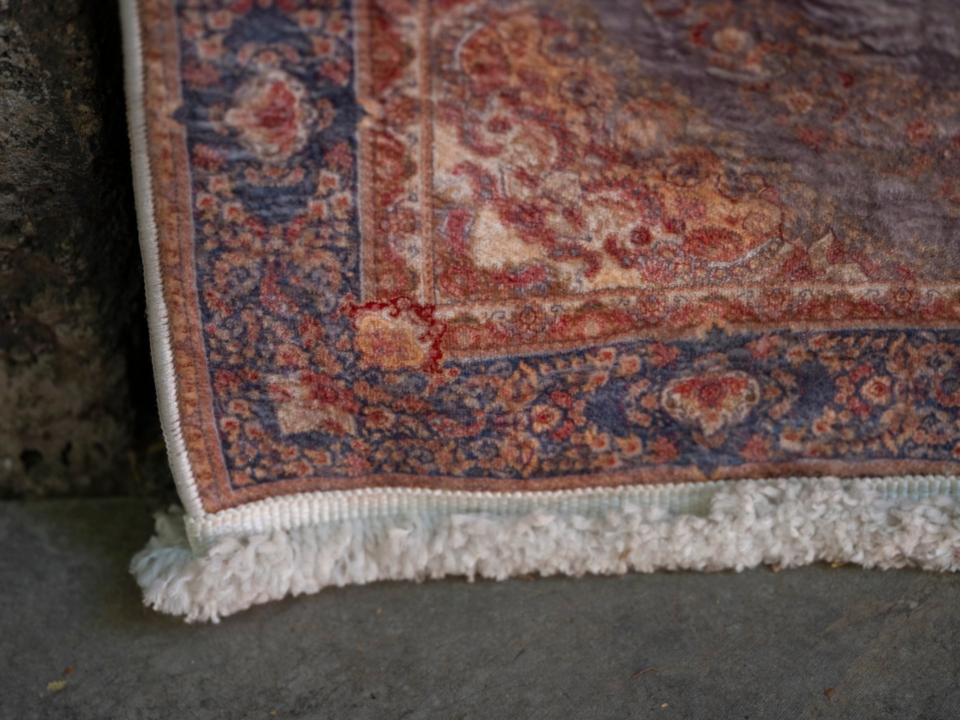 Antique heirloom rug with vintage patina needing specialized professional rug cleaning care