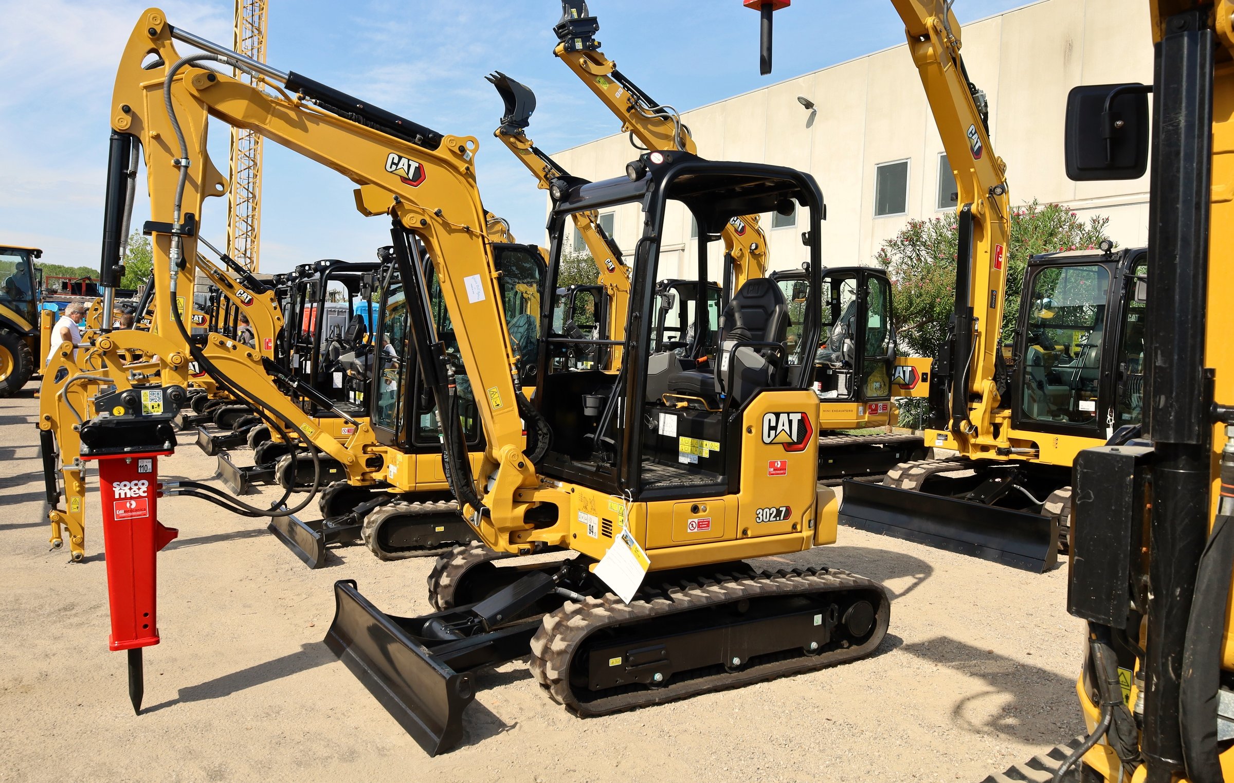 Pavia di Udine, Italy. September 3, 2022. Brand new Caterpillar CAT mini excavators on exhibition outside the official dealer.	Side view.