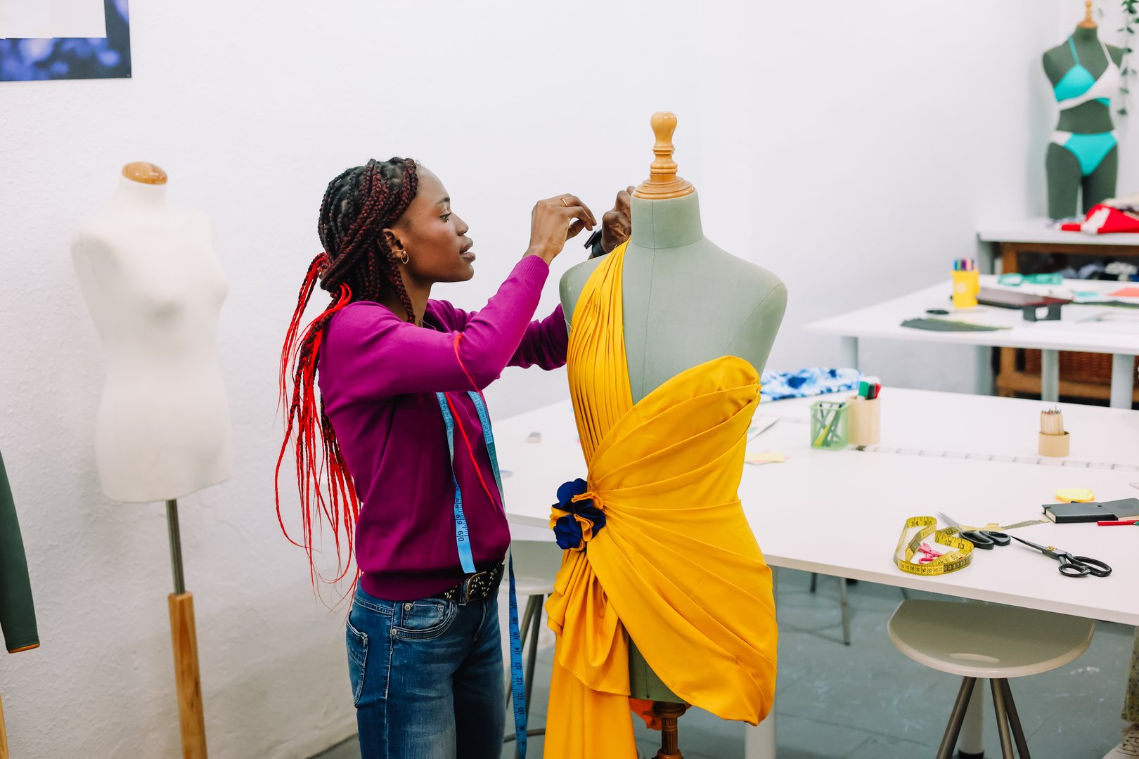African american dressmaker at her atelier. Woman entrepreneur at clothing small business