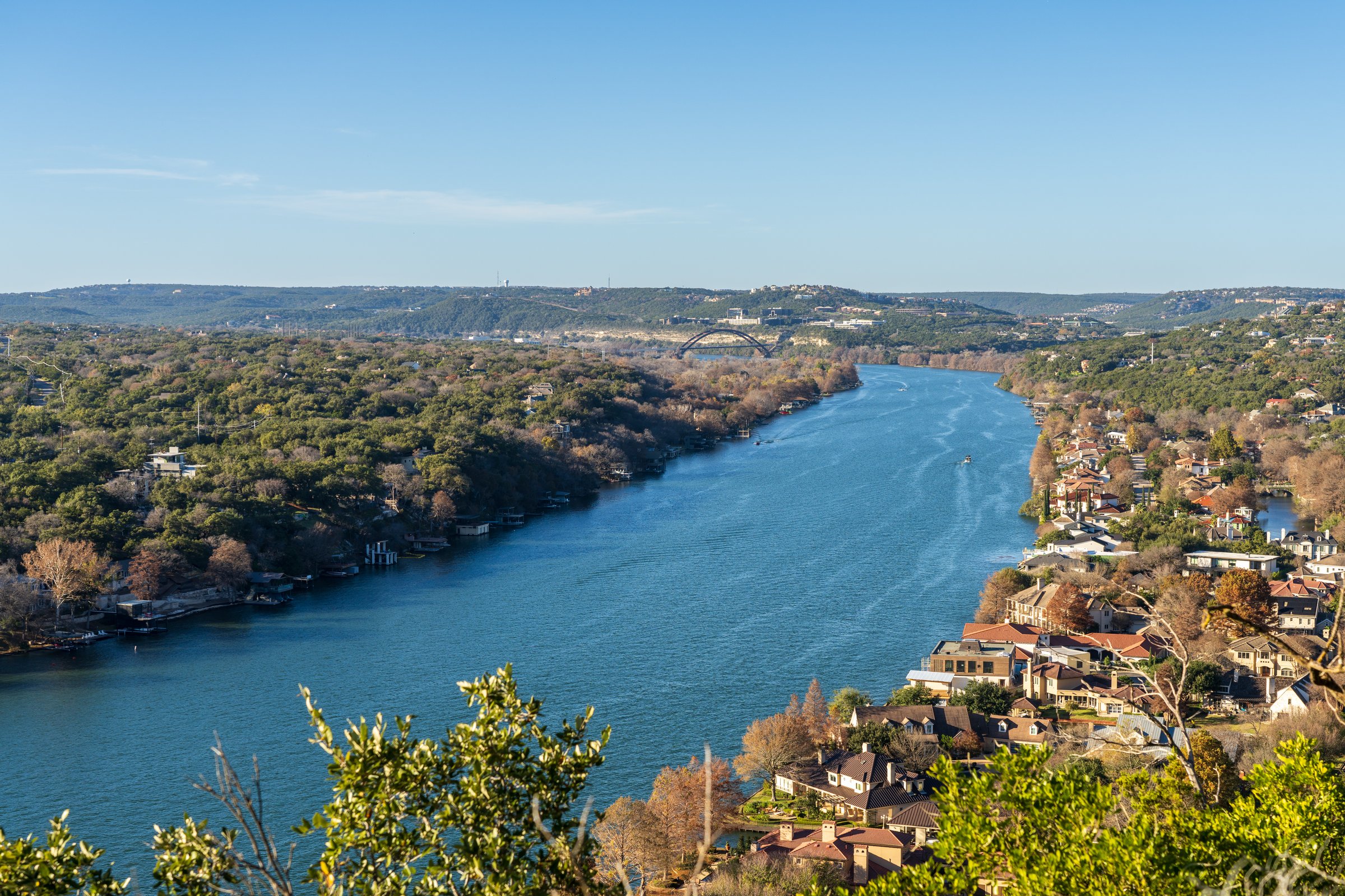 Expensive waterfront homes line the Colorado river near Austin Texas from Mount Bonnell