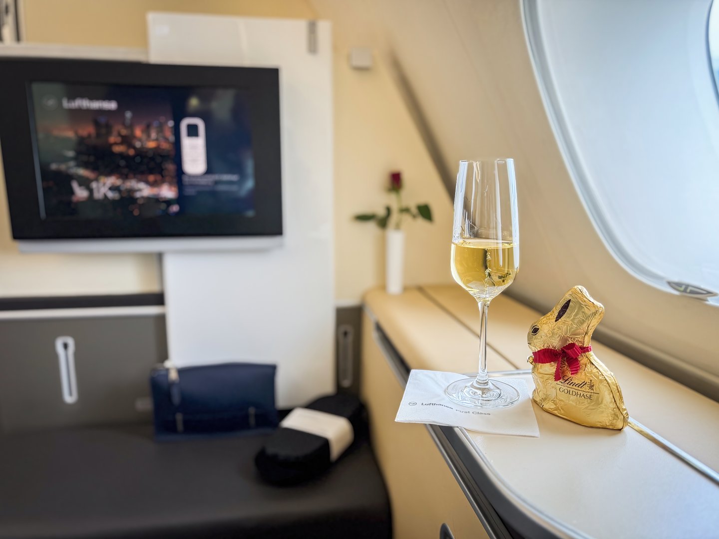 Munich, Germany - March 29, 2024: Lufthansa First Class seat 1K in an Airbus A380 with easter chocolate bunny