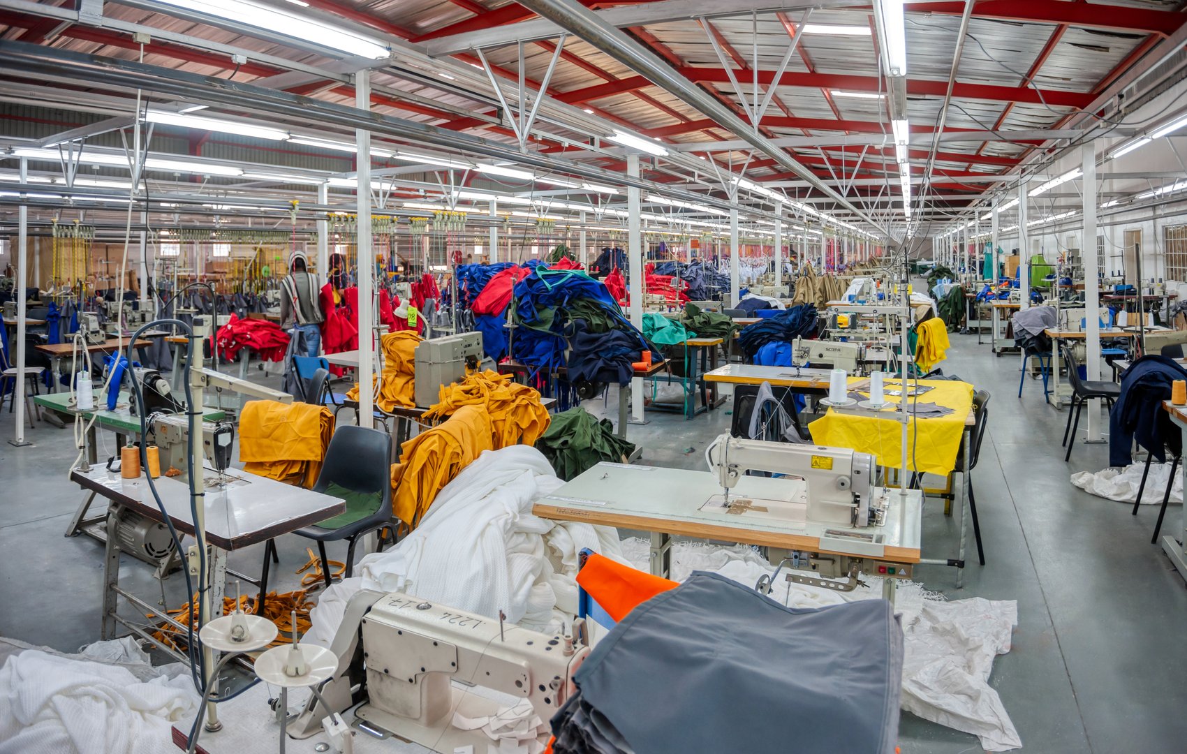 Small entrepreneur in Africa, Botswana, industrial textile factory manufacturing safety gear