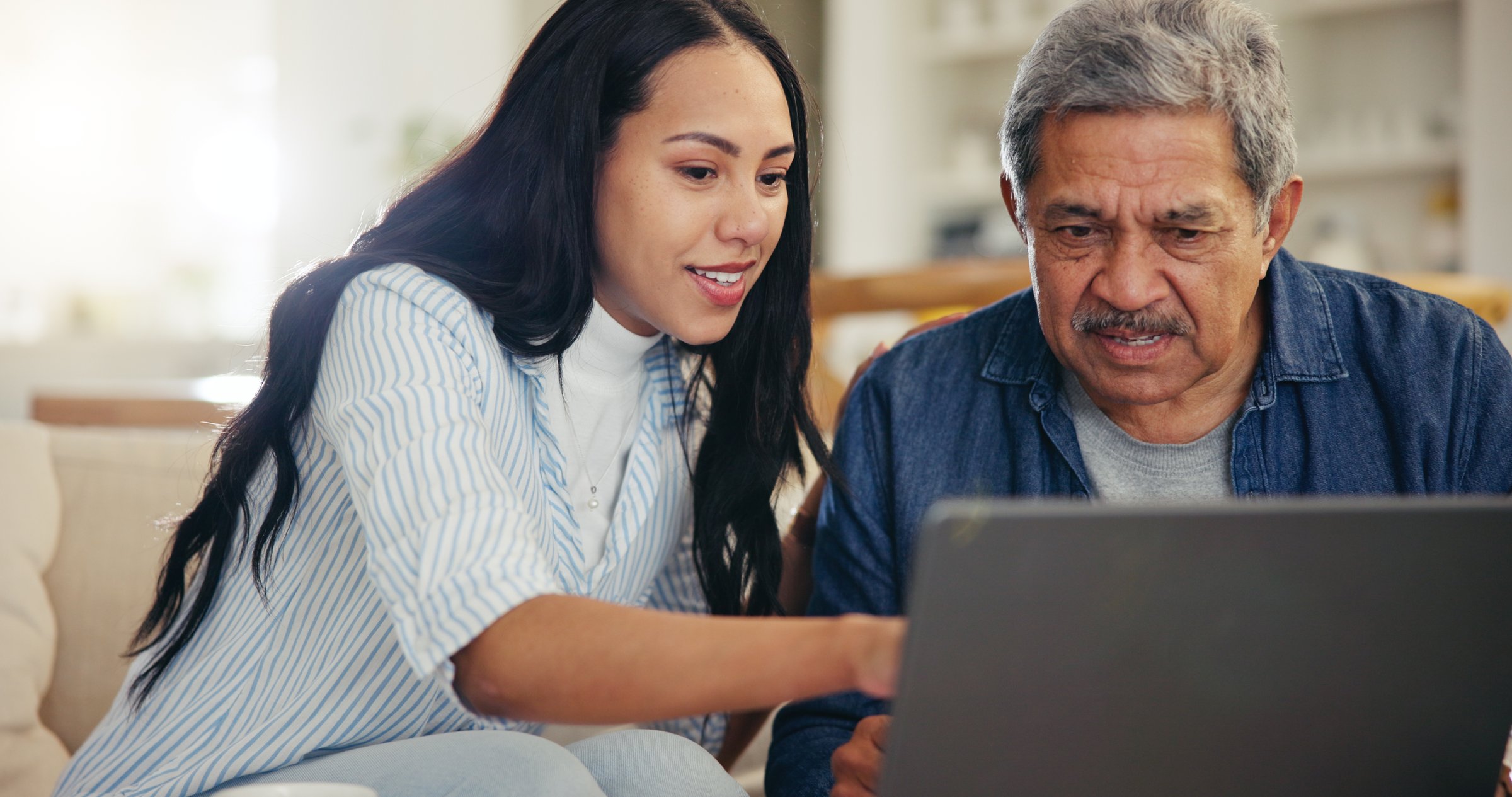 Woman, senior father and laptop with teaching, reading and typing for email notification, web or search. Computer, elderly dad and daughter with click, learning and family home lounge on social media