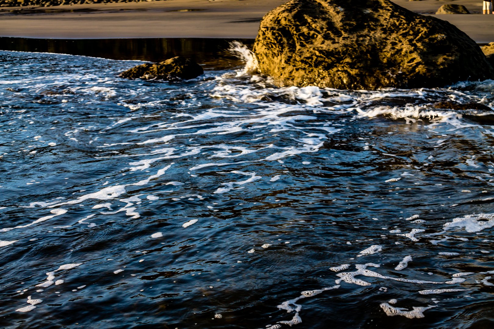 Surf rolling in on Opunaki Beach. Opunaki, New Zealand