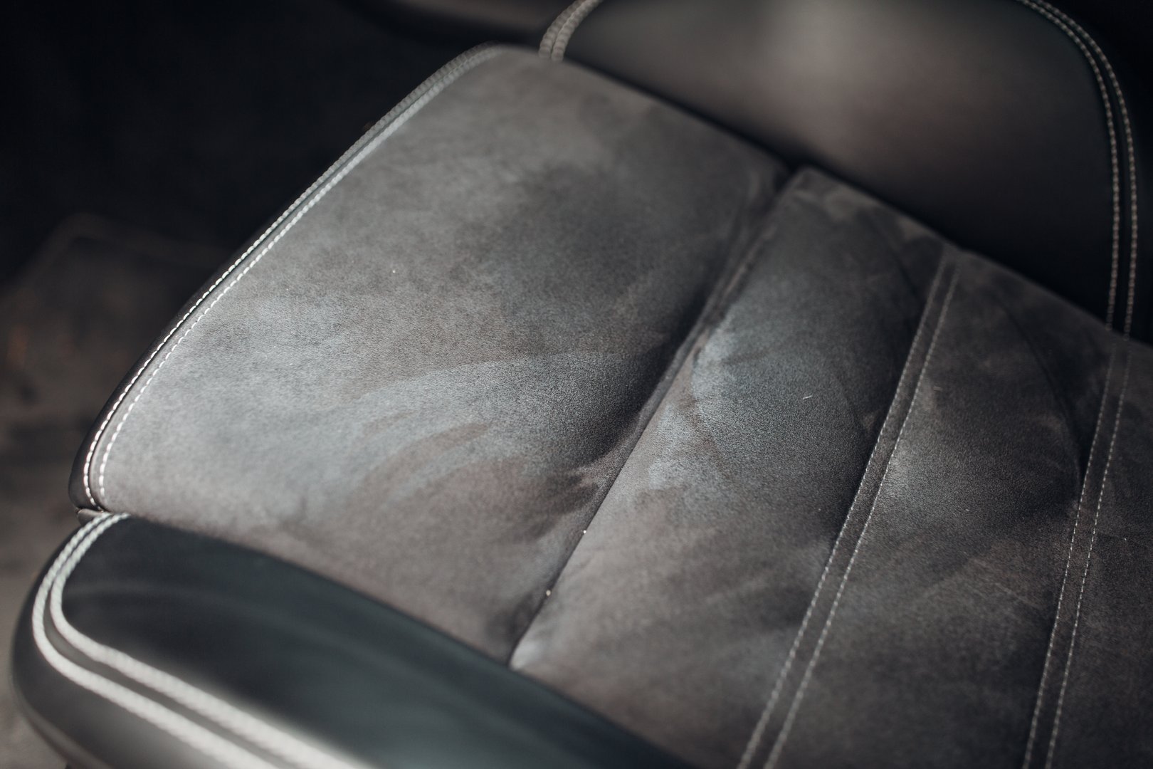 Grey leather car seat close up