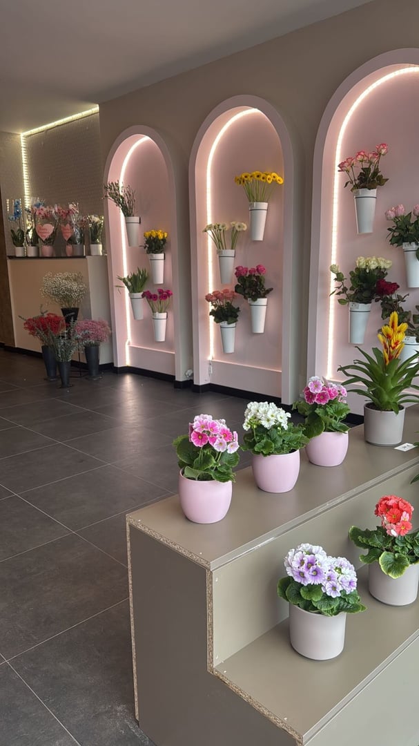 Bouquet of various flowers wrapped in pink paper isolated on white background, floral arrangement for various occasions, close up view, copy space