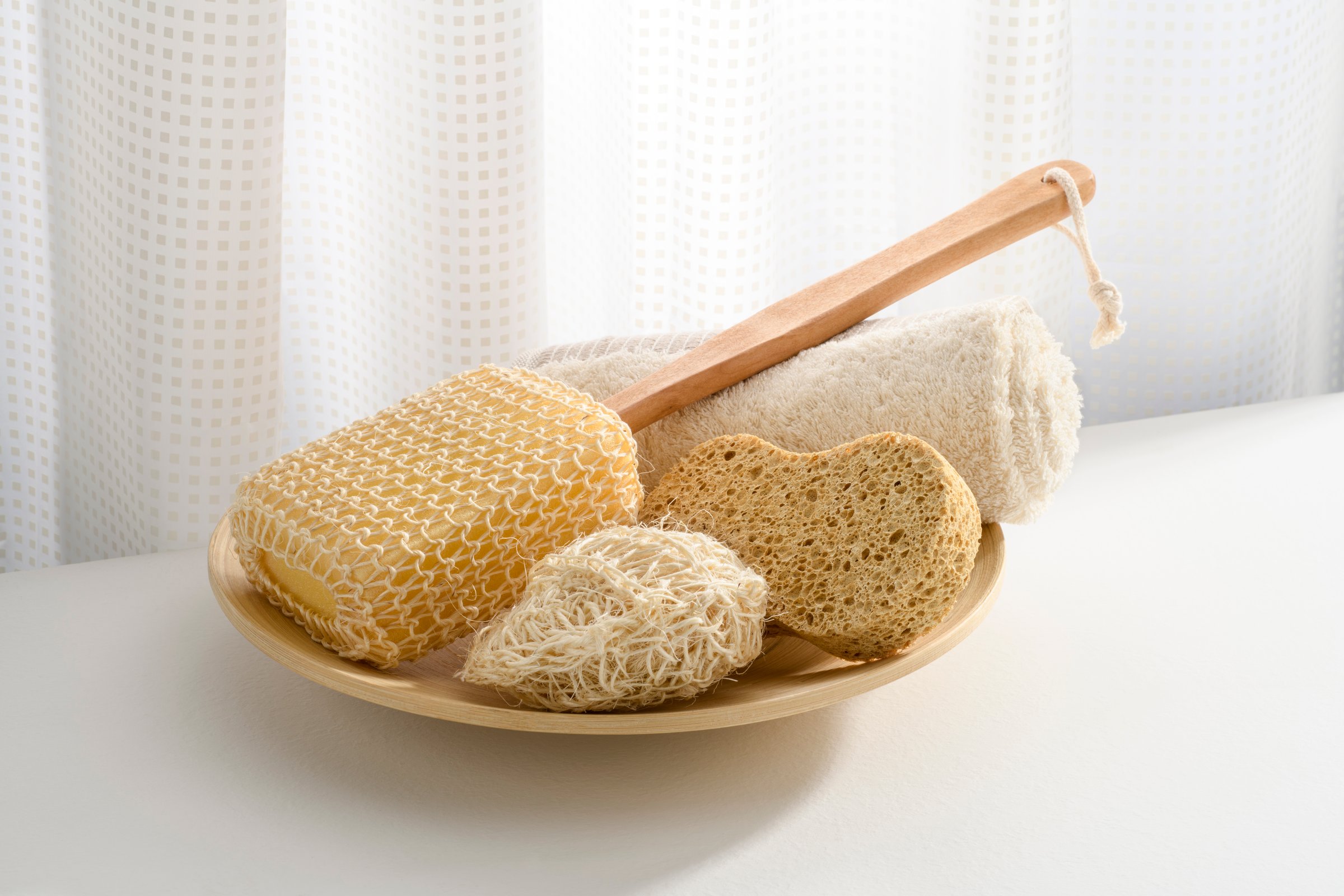 body care products near the shower curtain