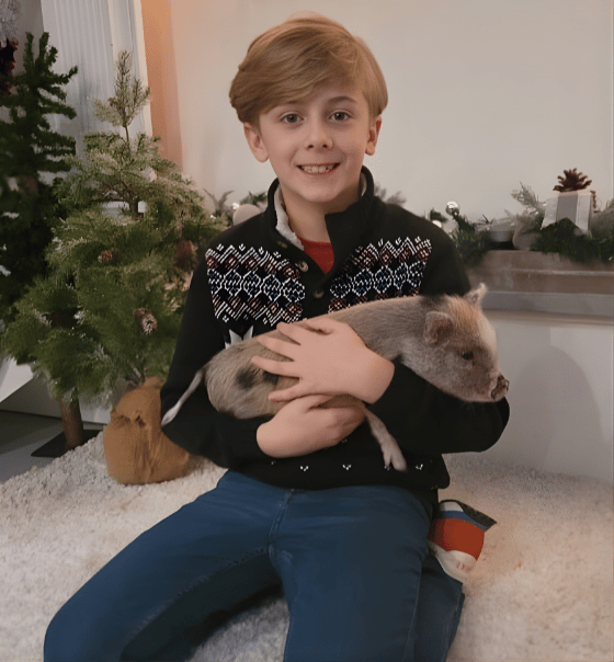 Child with piglet