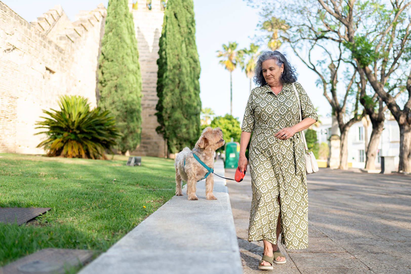 Senior woman walking her dog