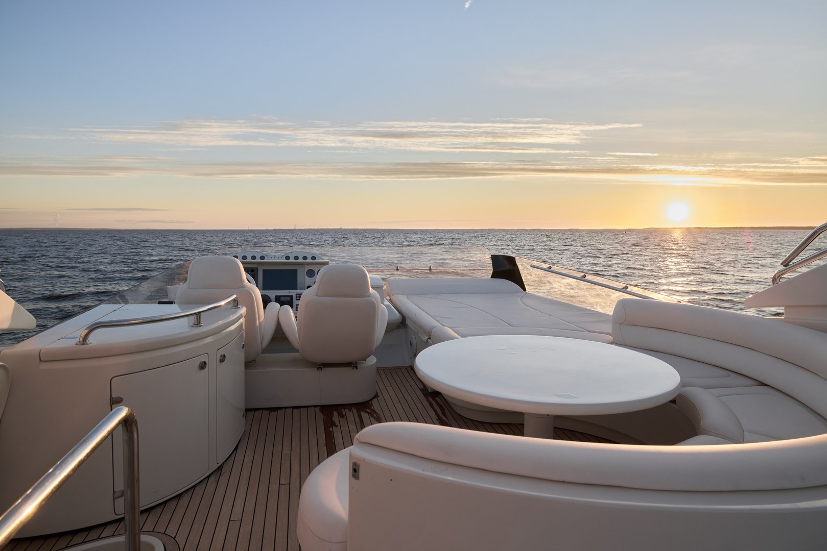 Immerse yourself in a truly serene and luxurious experience with an aweinspiring sunset view from a modern yacht