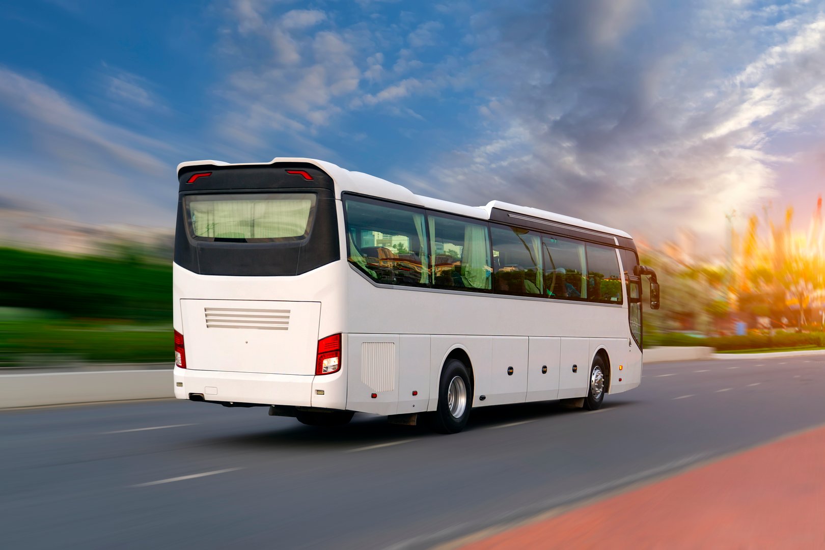 White tourist bus on highway